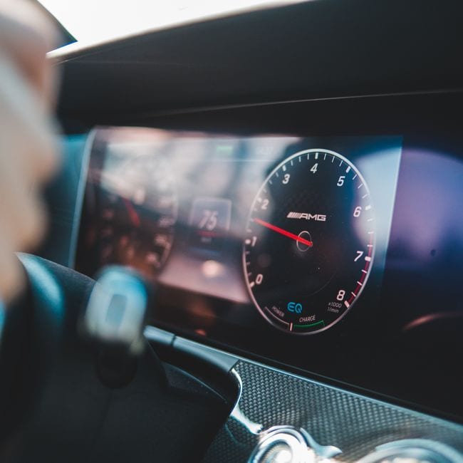 Automatic car dashboard and steering wheel during a driving lesson
