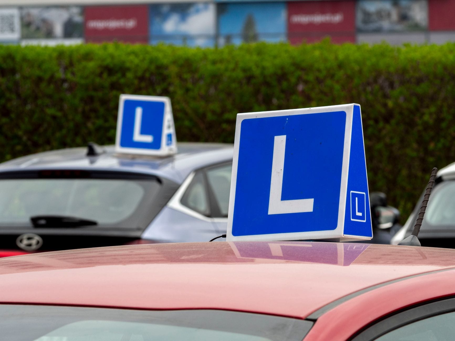 Driving instructor guiding a student through reverse parallel parking